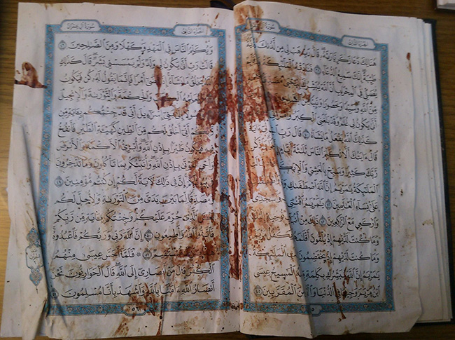 Коран, который лежал перед Рамаданом аль-Буты